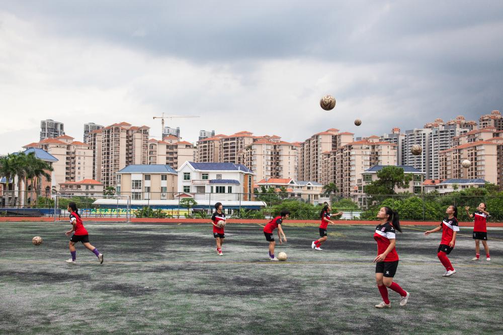 The "Dream of Dragons", a girls and disabled (deaf) football team photographed by Chris Steele-Perkins in 2016 at Zhanjiang, China
