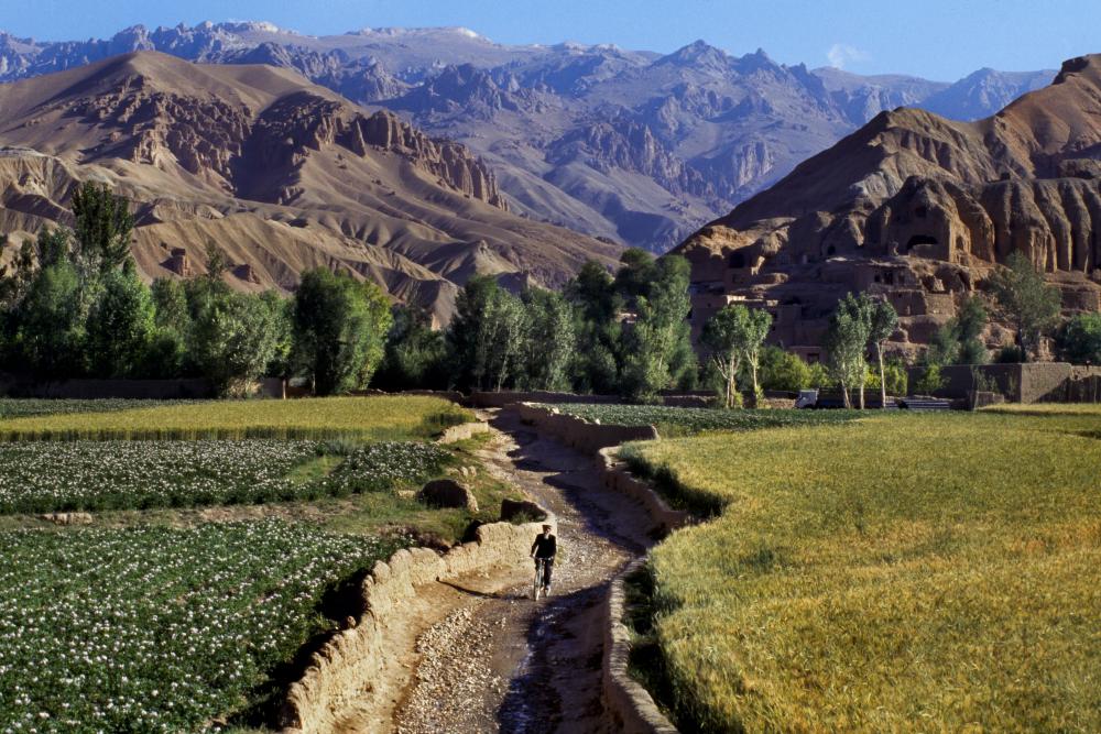 Steve McCurry pictured the man cycling in this magnificent Afghan landscape in 2006