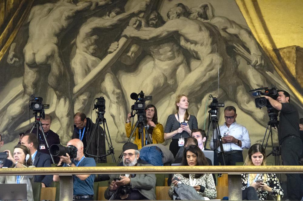 Photographer Violaine Martin took the above scene featuring journalists waiting for the delegation prior to the opening of the Syrian Constitutional Committee at UN Geneva on 30 October 2019