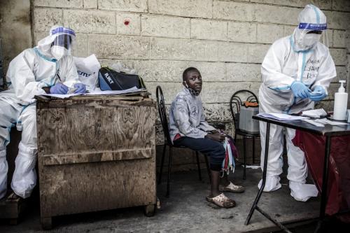 A kid waits for his samples to be collected by a health worker during the COVID-19 coronavirus mass testing exercise inducted by Kenya’s Ministry of Health in the Kawangware slums of Nairobi on 1 May 2020. By Luis Tato / AFP