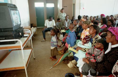Kenya. Nairobi. At a health center in Dandora slums, an AIDS awareness video is shown. 1998