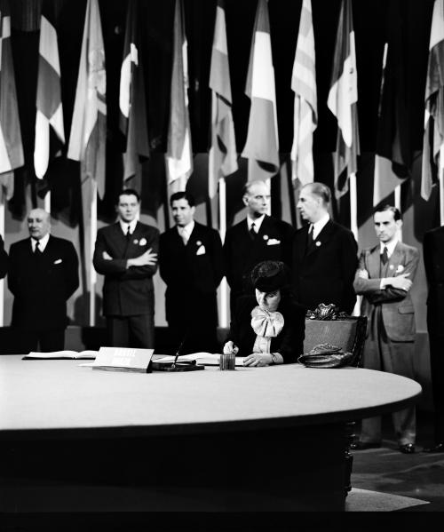 Dr. Bertha Lutz, National Museum, President of the Confederated Association of Women of Brazil, former Congresswoman and member of the delegation from Brazil, signing the UN Charter at a ceremony held at the Veterans' War Memorial Building on 26 June 1945.